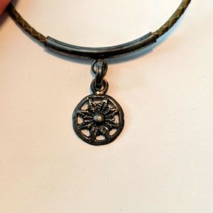 Flower medallion on braided leather